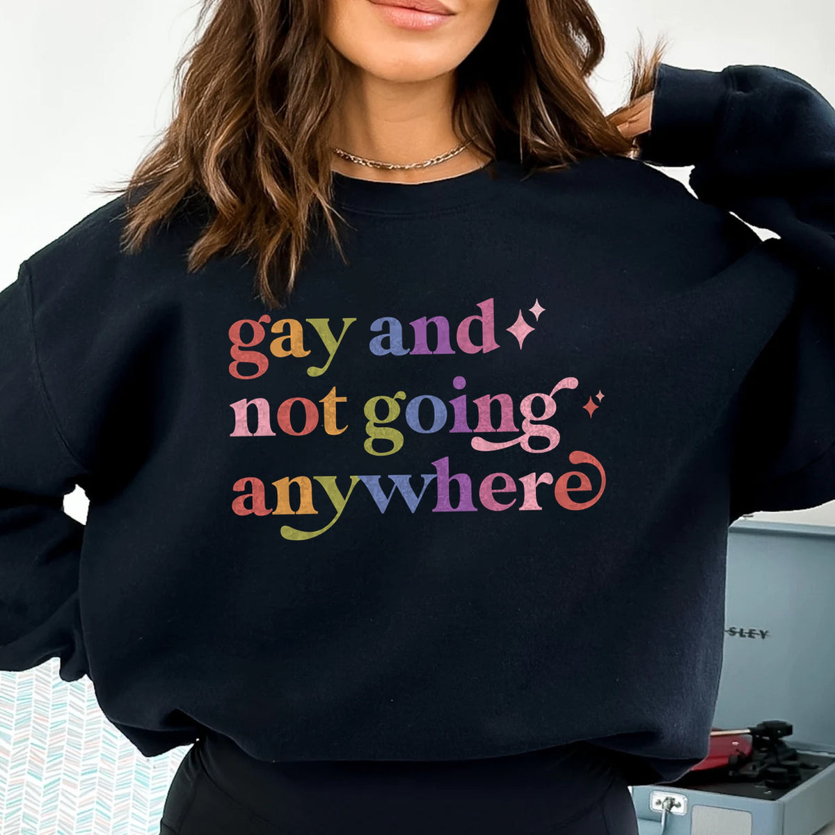 Gay and not Going Anywhere Care & Resist Gildan crewneck sweatshirt in Black