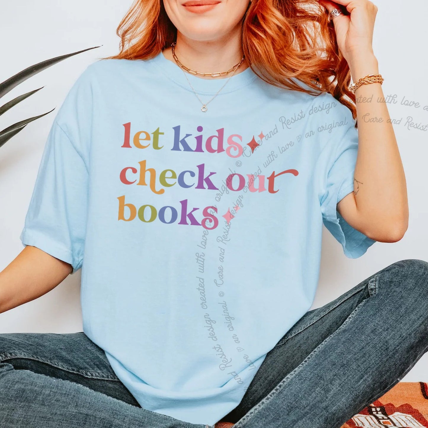 Let Kids Check Out Books Care & Resist rainbow tee