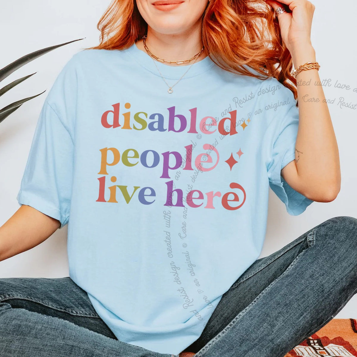 Disabled People Live Here Care & Resist rainbow tee