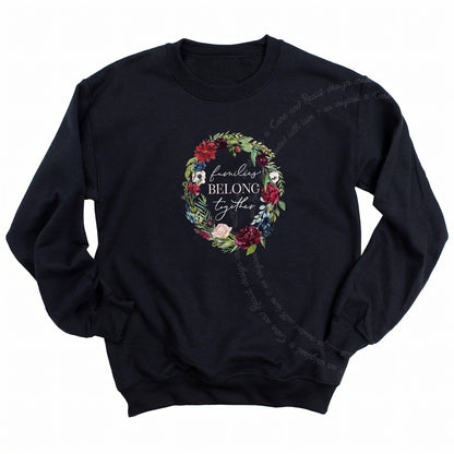 Families Belong Together Wreath Care & Resist Gildan crewneck sweatshirt in Black