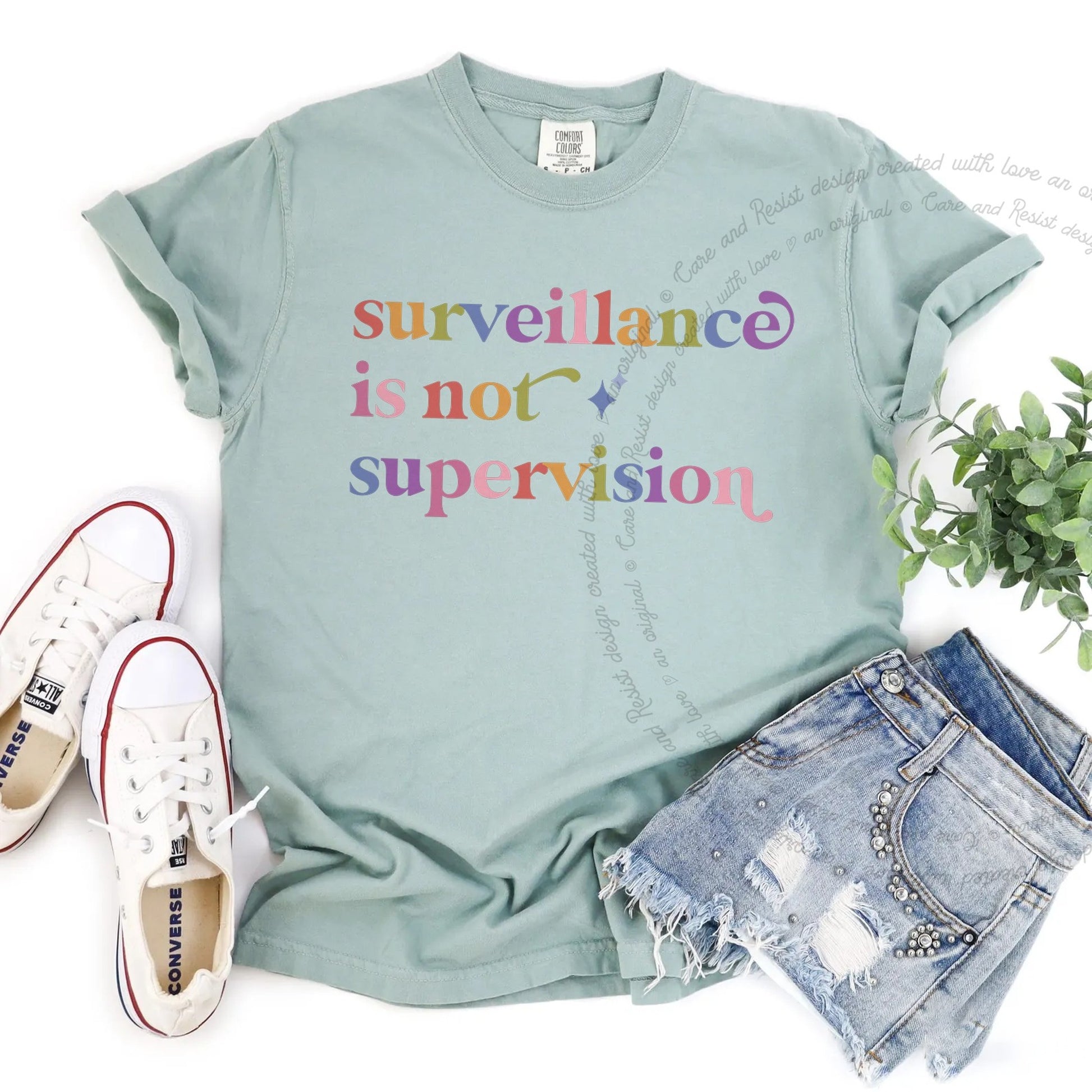 Surveillance is not Supervision Care & Resist rainbow Comfort Colors tee, Bay
