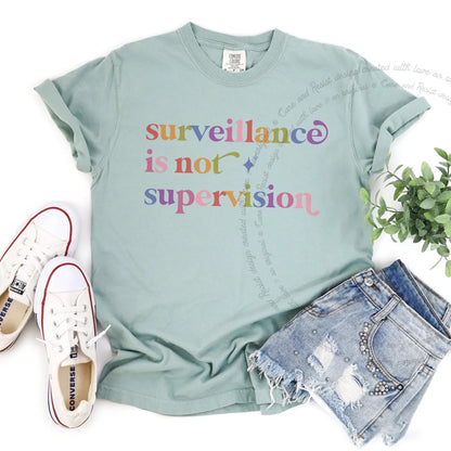 Surveillance is not Supervision Care & Resist rainbow Comfort Colors tee, Bay