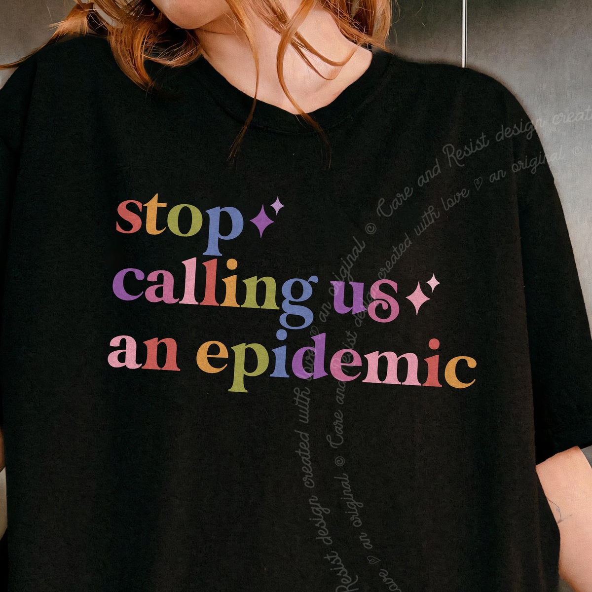 Stop Calling Us an Epidemic Care & Resist tee in Black, close-up of the lettering