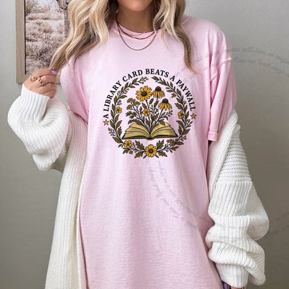 A Library Card Beats a Paywall Badge Care & Resist progressive t-shirt in Blossom
