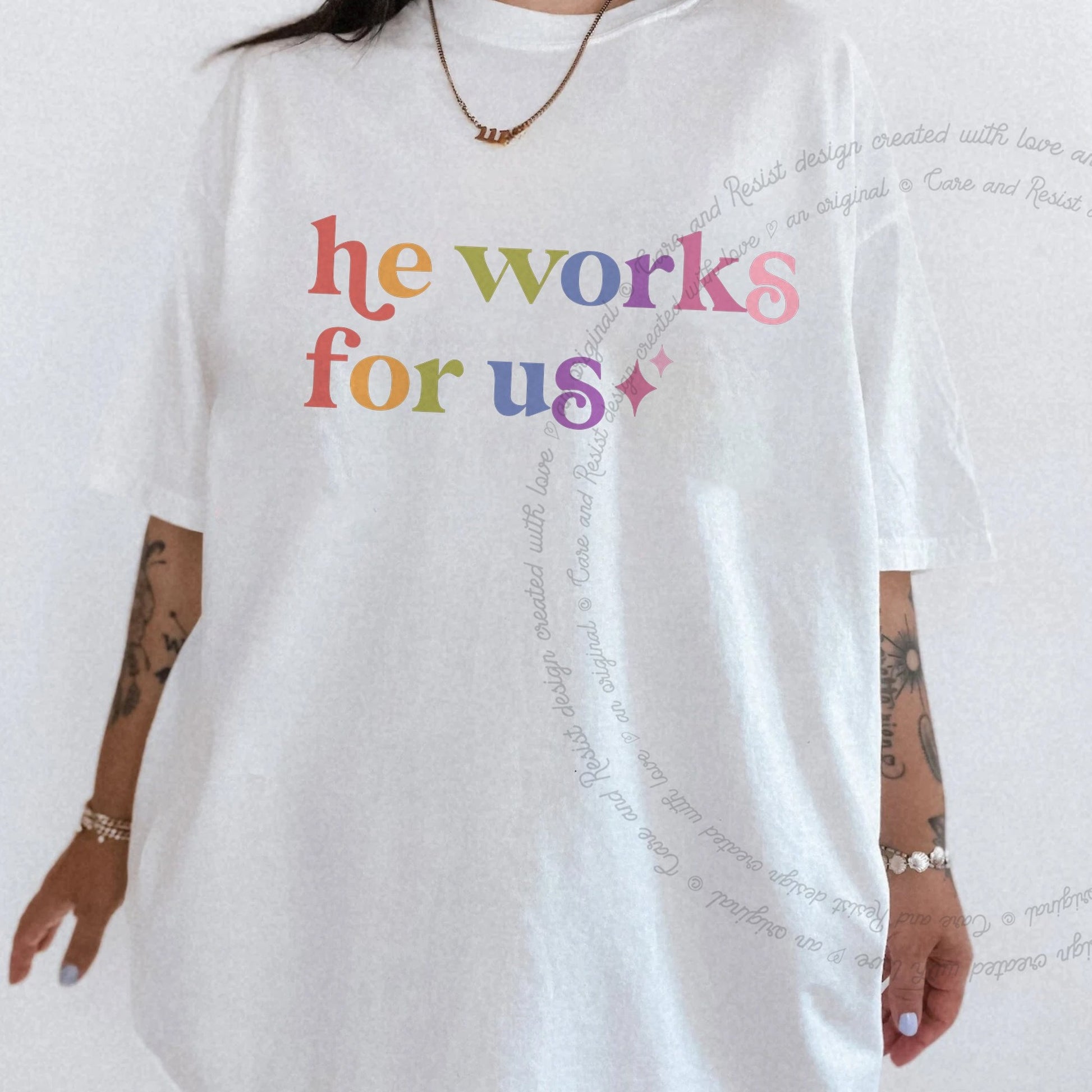 He Works for Us Care & Resist rainbow tee