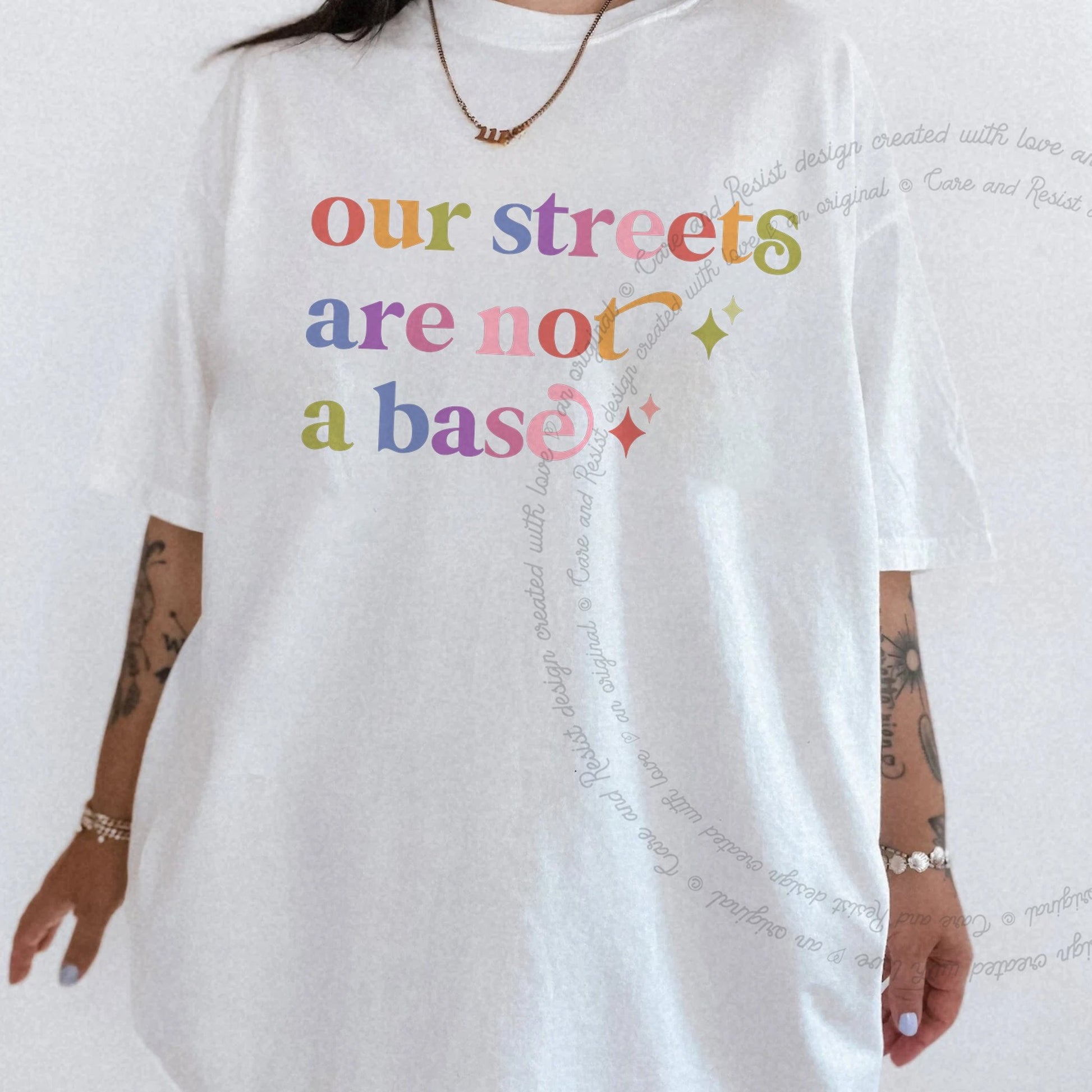 Our Streets are not a Base Care & Resist rainbow tee