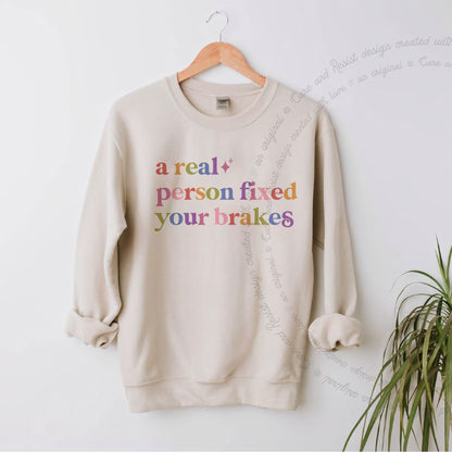A Real Person Fixed Your Brakes Care & Resist Gildan crewneck sweatshirt in Sand
