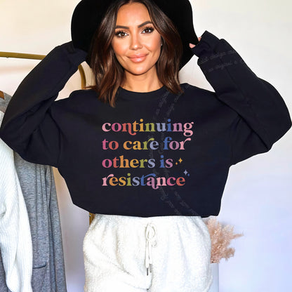 Continuing to Care for Others Is Resistance Care & Resist Gildan crewneck sweatshirt in Black