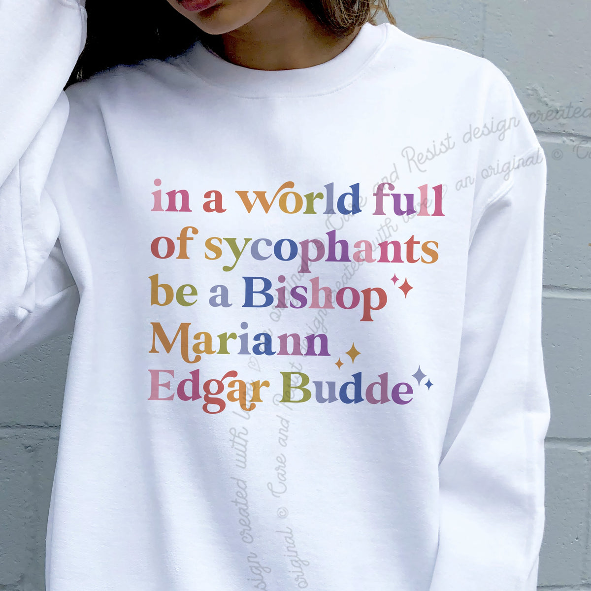 In a World Full of Sycophants Be a Bishop Mariann Edgar Budde Care & Resist Gildan crewneck sweatshirt in White