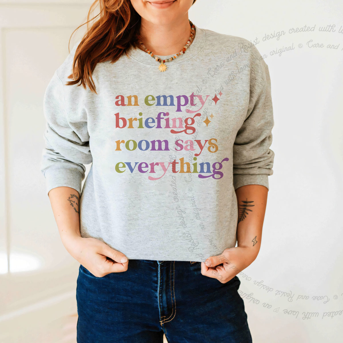 An Empty Briefing Room Says Everything Care & Resist Gildan crewneck sweatshirt in Sport Grey