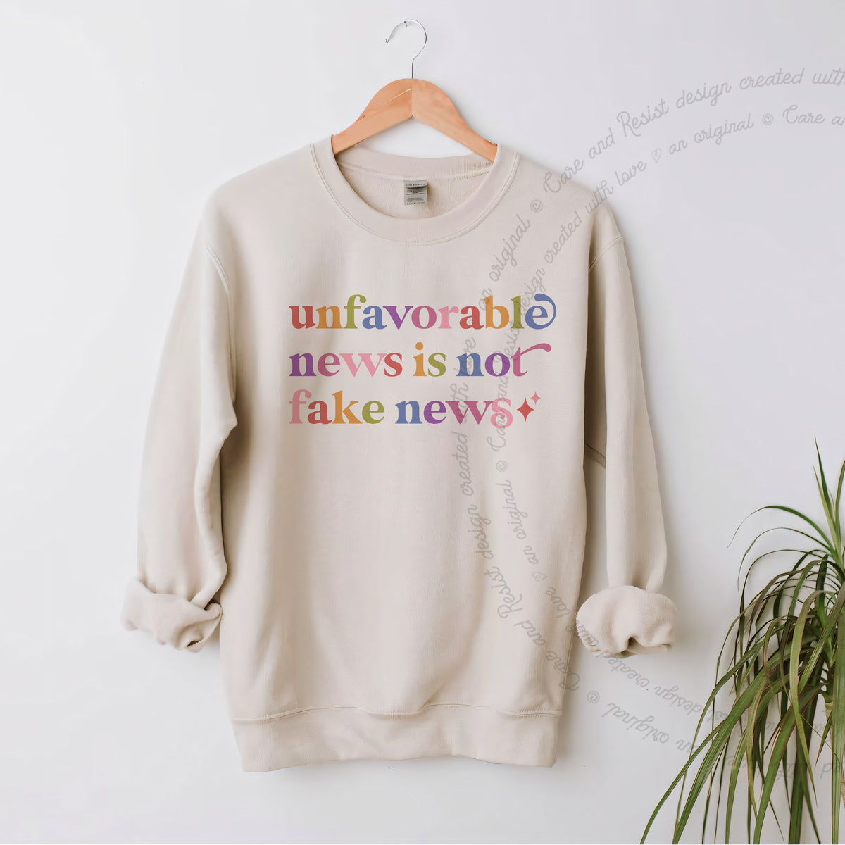 Unfavorable News is not Fake News Care & Resist Gildan crewneck sweatshirt in Sand