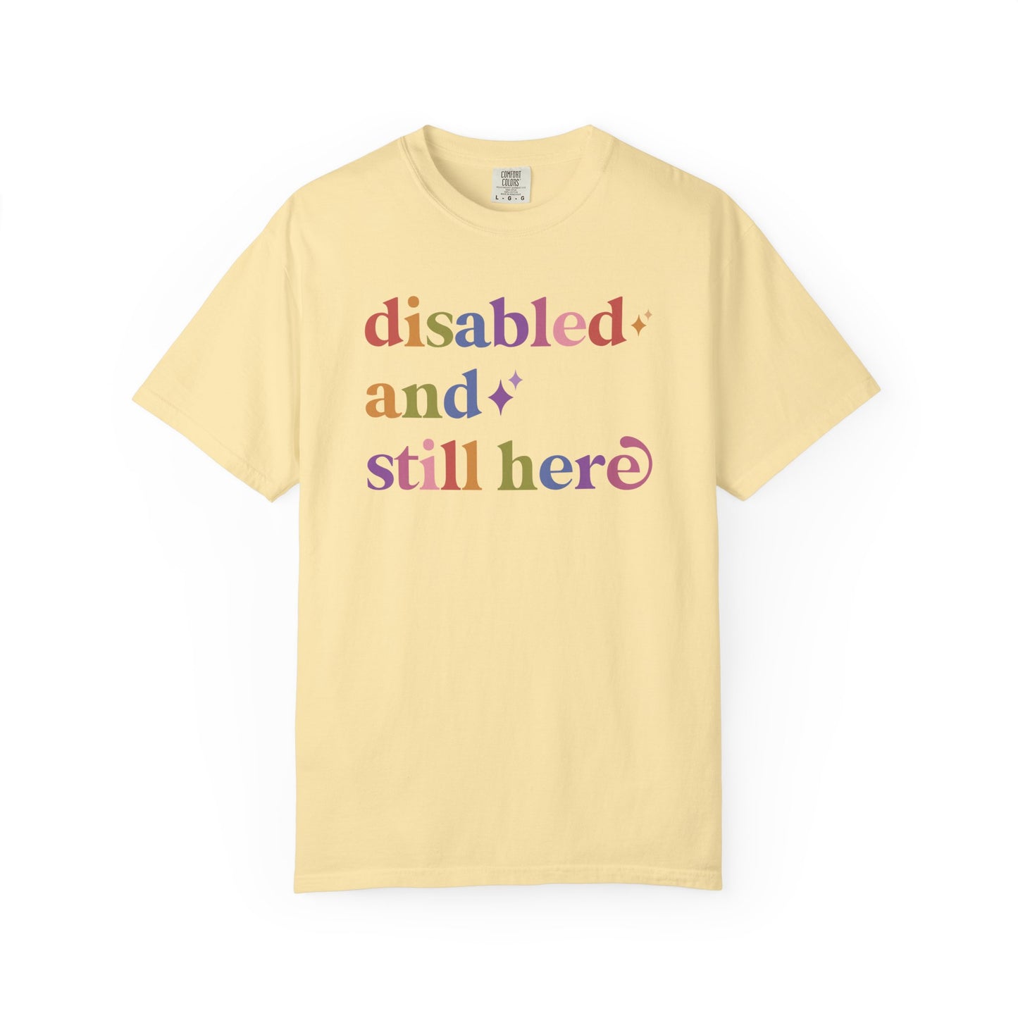 Disabled and Still Here Care & Resist rainbow Comfort Colors tee