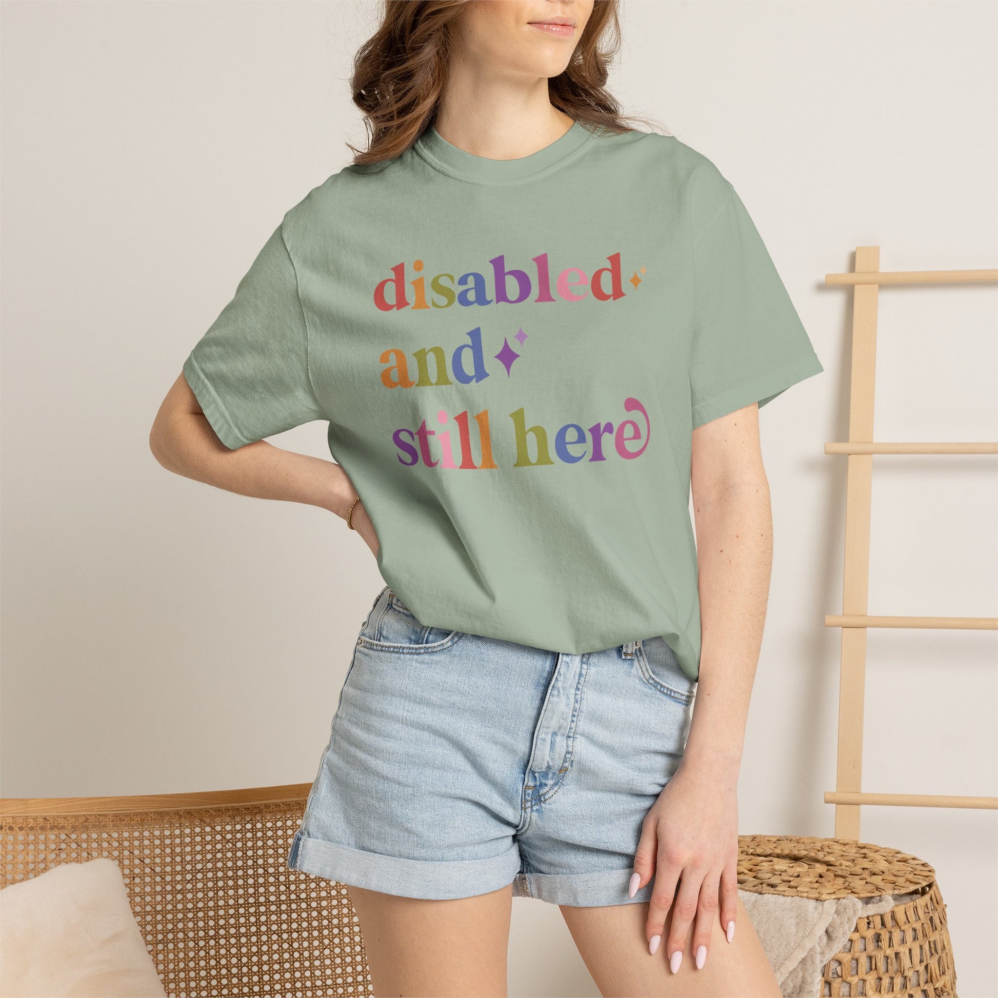Disabled and Still Here Care & Resist rainbow Comfort Colors tee