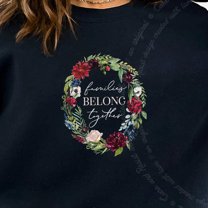 Families Belong Together Wreath Care & Resist Gildan crewneck sweatshirt in Black