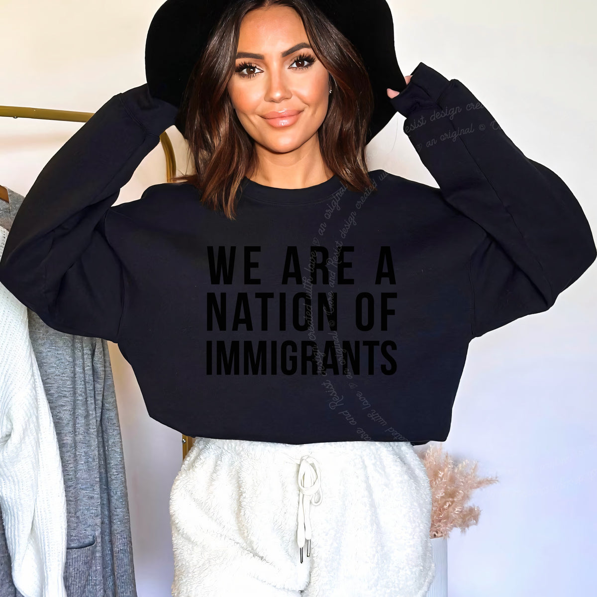 We Are a Nation of Immigrants Care & Resist Gildan crewneck sweatshirt in Black