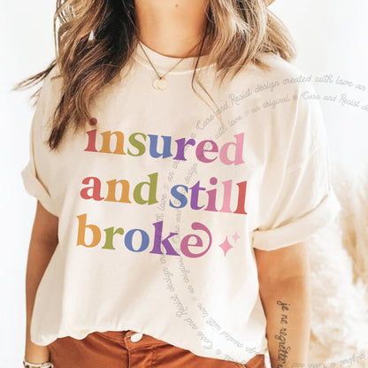 Insured and Still Broke Care & Resist rainbow Comfort Colors tee, Ivory