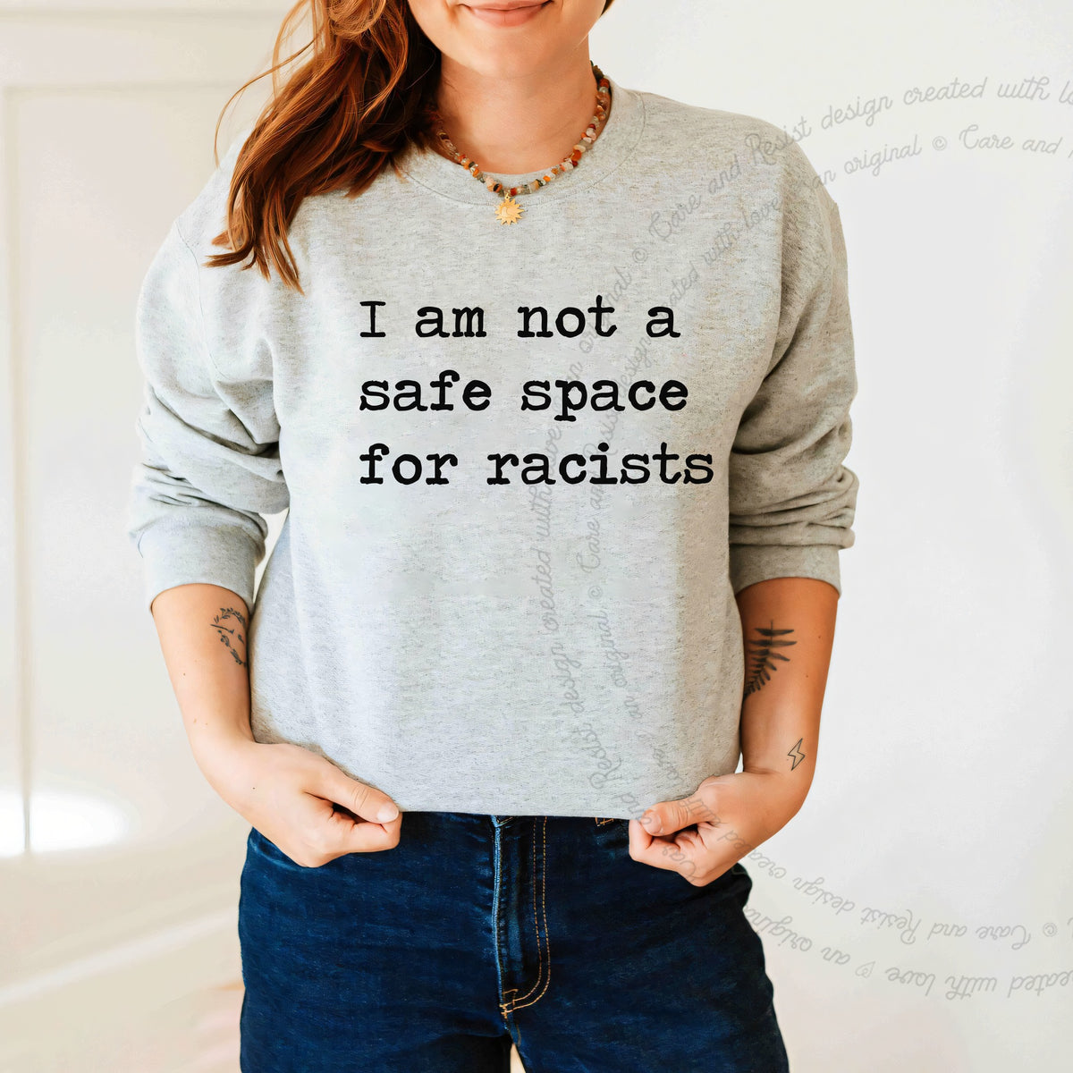 I Am Not a Safe Space for Racists Care & Resist Gildan crewneck sweatshirt in Sport Grey