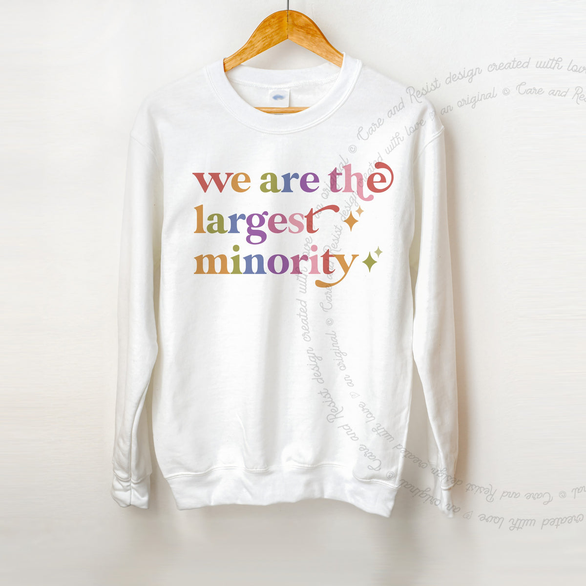We are the Largest Minority Care & Resist Gildan crewneck sweatshirt in White