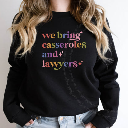 We Bring Casseroles and Lawyers Care & Resist Gildan crewneck sweatshirt in Black