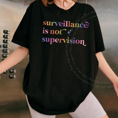 Surveillance is not Supervision Care & Resist rainbow Comfort Colors tee, Black