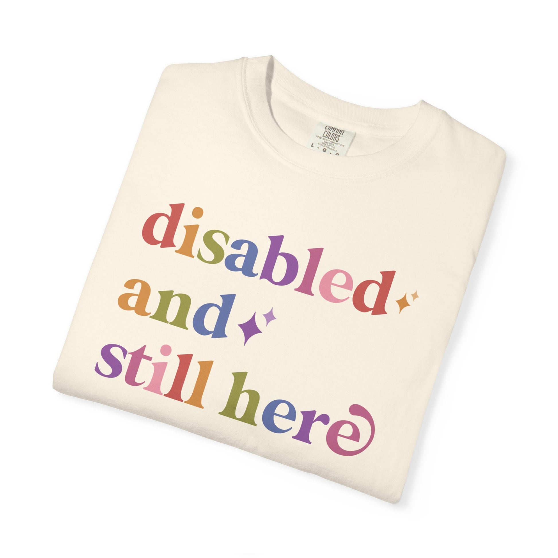 Disabled and Still Here Care & Resist rainbow Comfort Colors tee