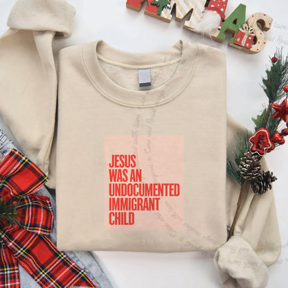 Jesus Was an Undocumented Immigrant Child Care & Resist Gildan crewneck sweatshirt in Sand