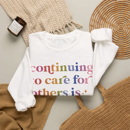 Continuing to Care for Others Is Resistance Sweatshirt