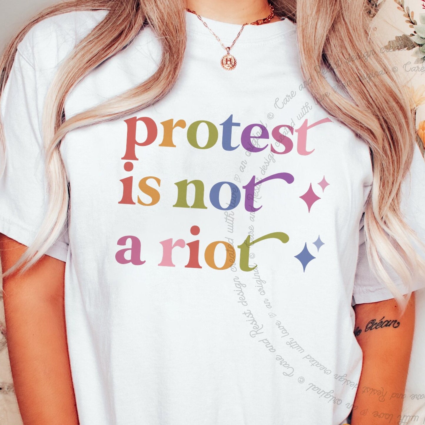 Protest is not a Riot Care & Resist rainbow Comfort Colors tee, White