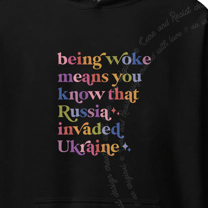 Being Woke Means You Know That Russia Invaded Ukraine Care & Resist Gildan hoodie in Black