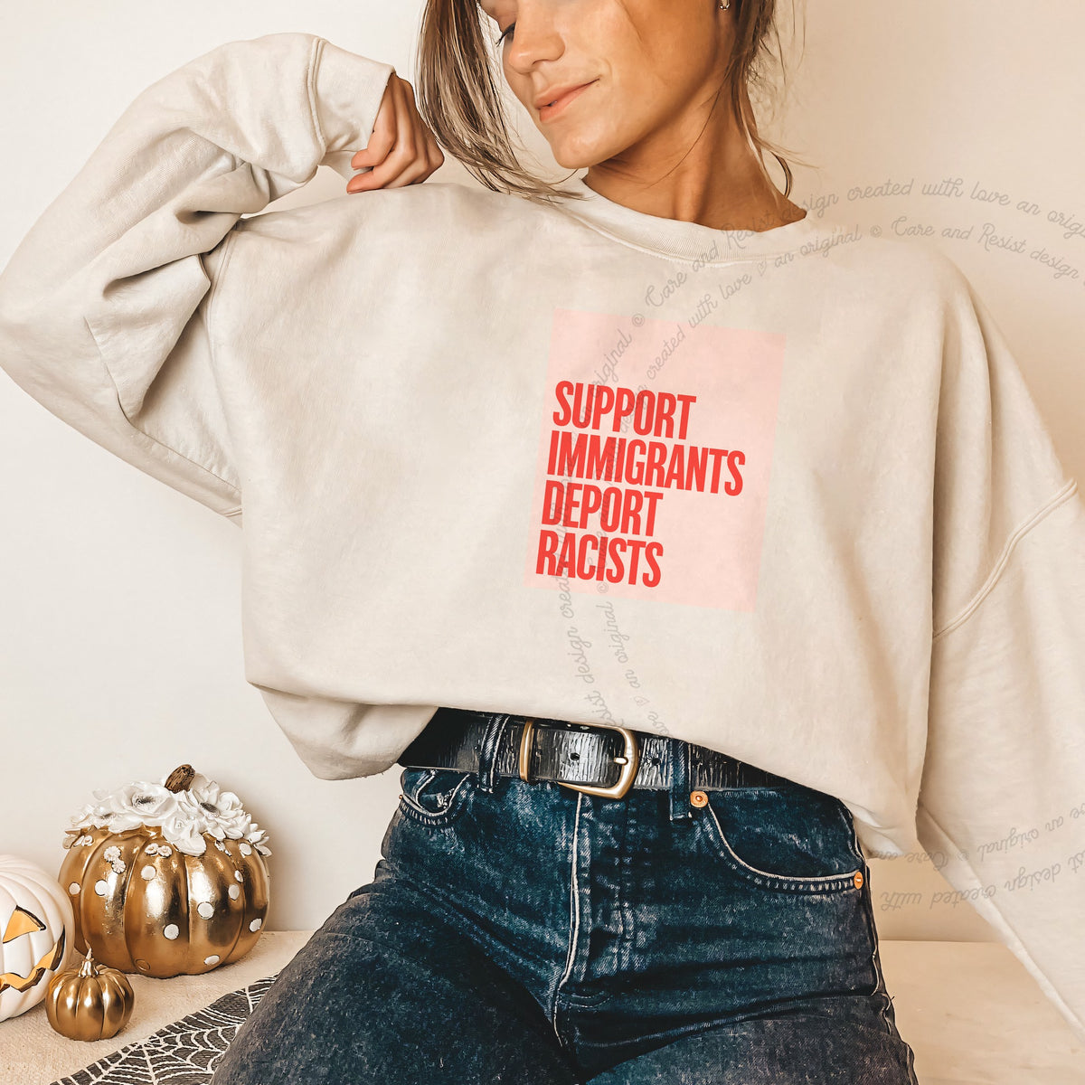 Support Immigrants Deport Racists Care & Resist Gildan crewneck sweatshirt in Sand