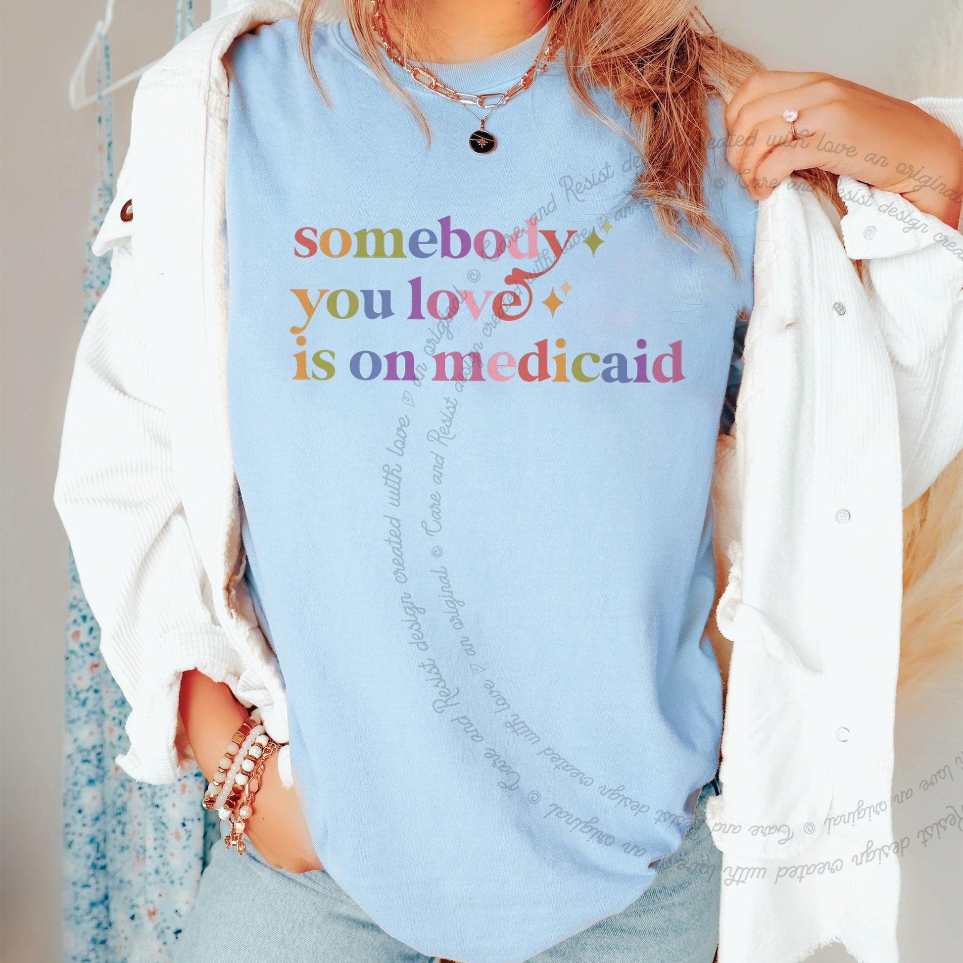 Somebody You Love is on Medicaid Care & Resist rainbow Comfort Colors tee, Chambray