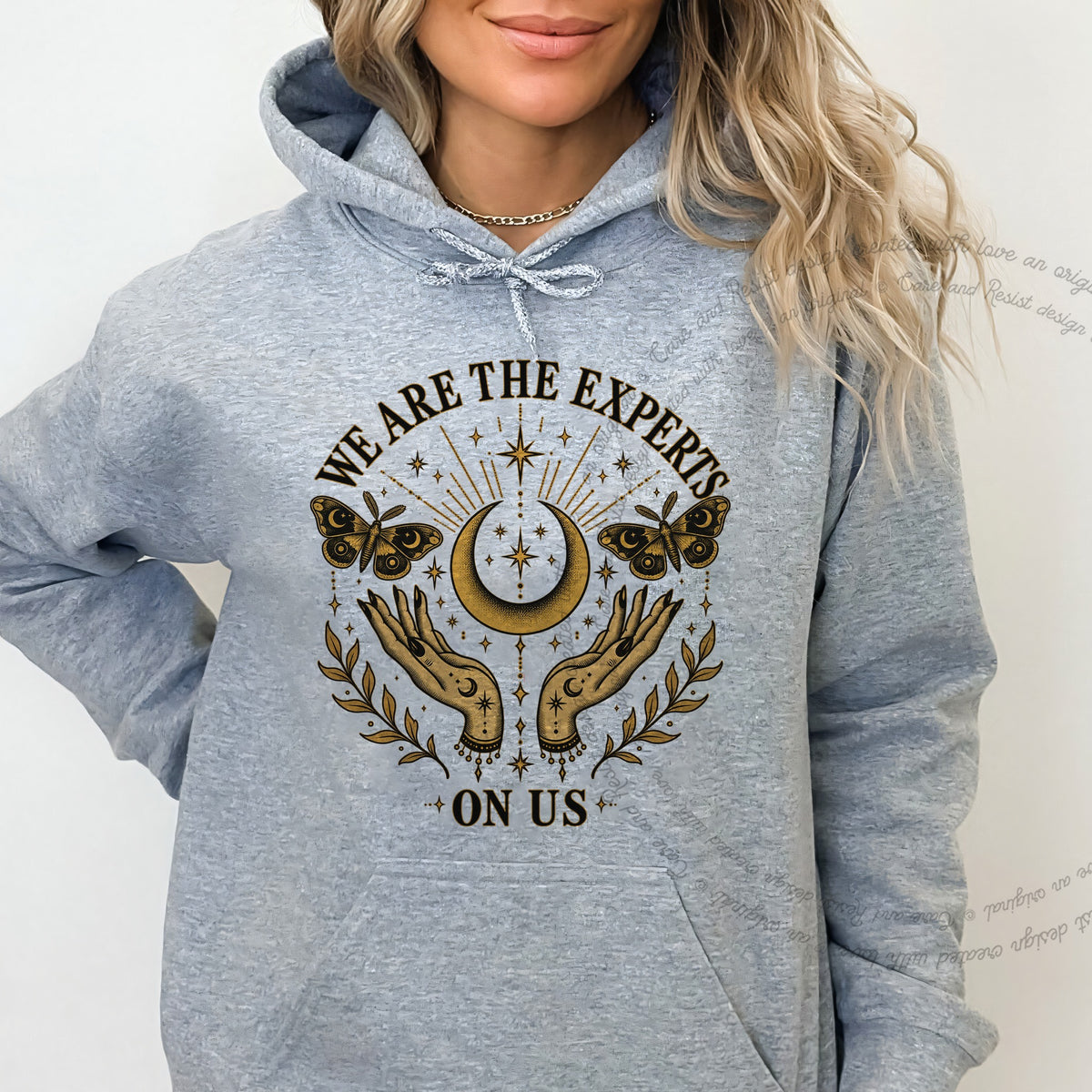We are the Experts on Us Celestial Care & Resist Gildan hoodie in Sport Grey