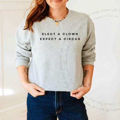 Elect a Clown Expect a Circus Care & Resist Gildan crewneck sweatshirt in Sport Grey