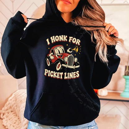 I Honk for Picket Lines Cartoon Care & Resist Gildan hoodie in Black