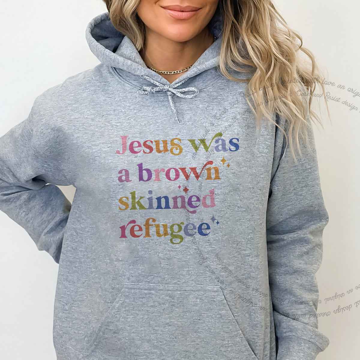 Jesus Was a Brown Skinned Refugee Care & Resist Gildan hoodie in Sport Grey