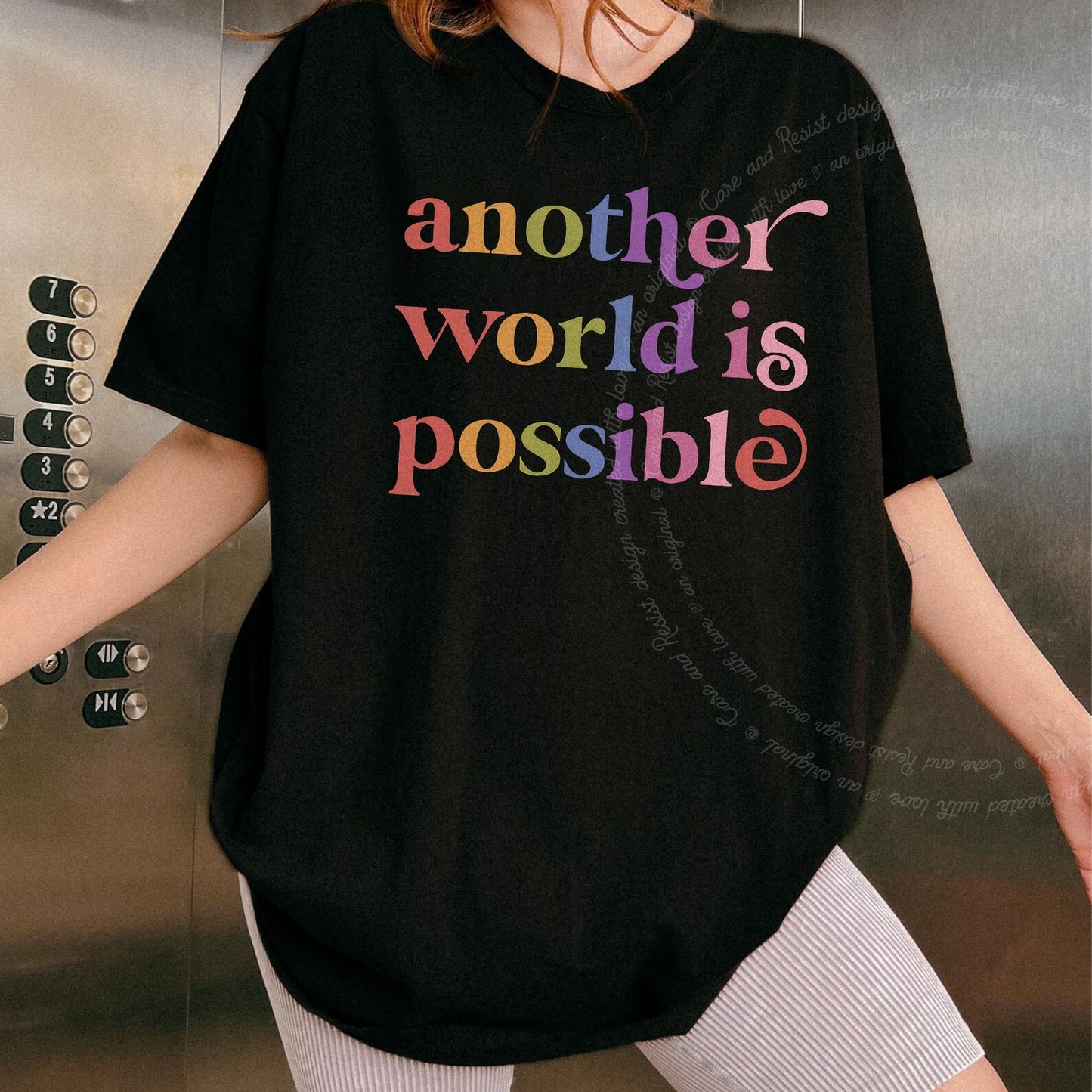 Another World is Possible Care & Resist rainbow Comfort Colors tee, Black