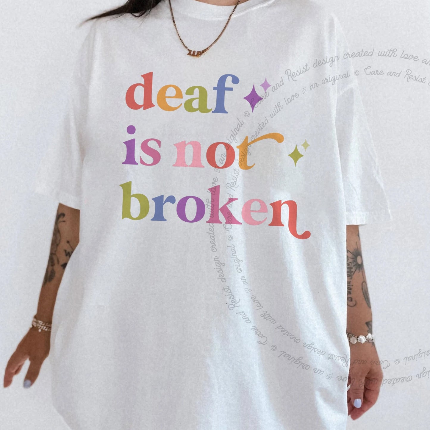 Deaf is not Broken Care & Resist rainbow tee
