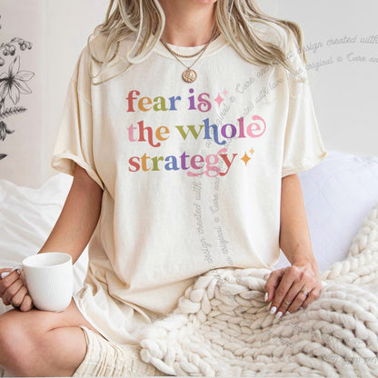 Fear is the Whole Strategy Care & Resist rainbow tee