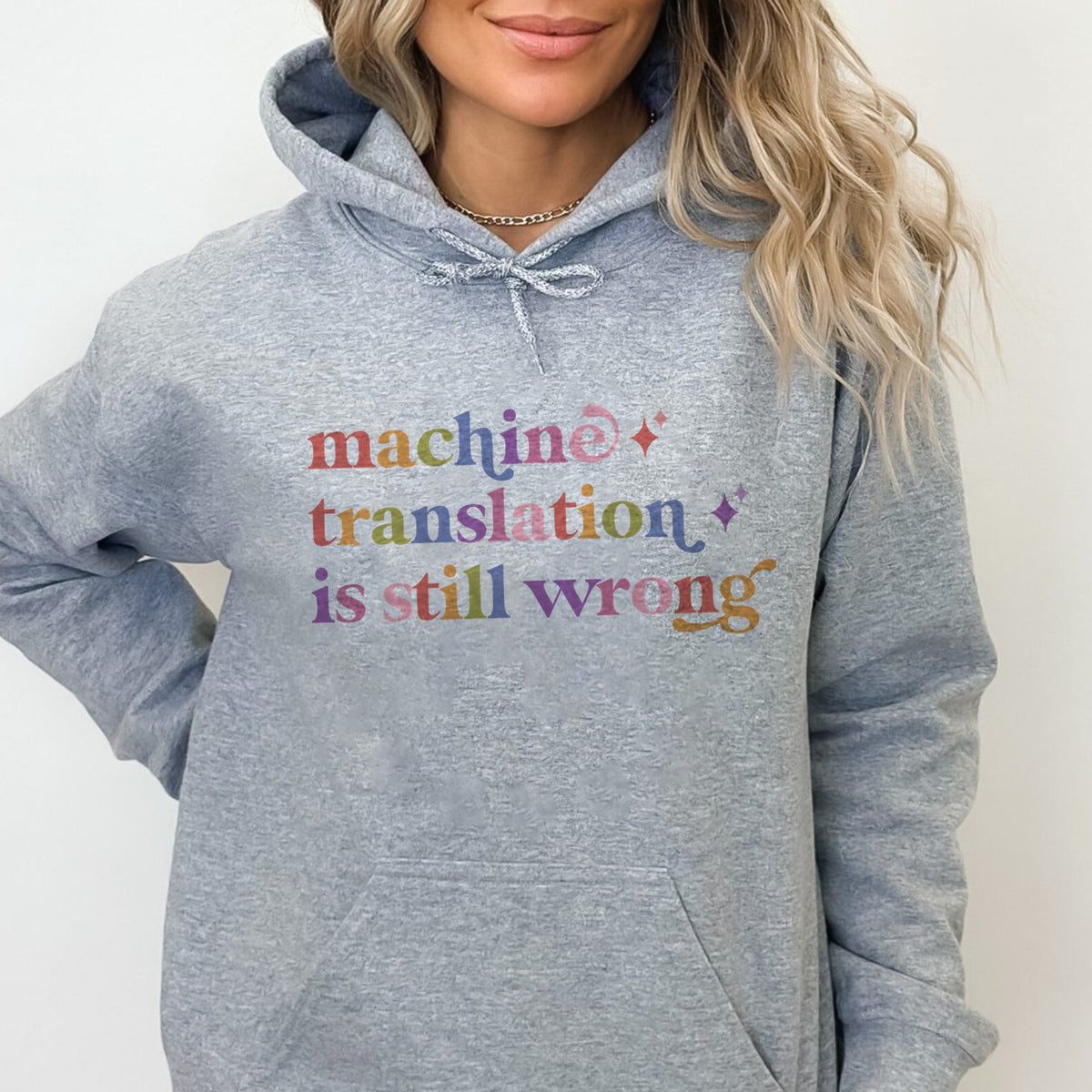 Machine Translation is Still Wrong Care & Resist Gildan hoodie in Sport Grey