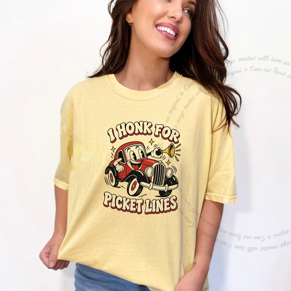 I Honk for Picket Lines Cartoon Care & Resist progressive t-shirt in Banana