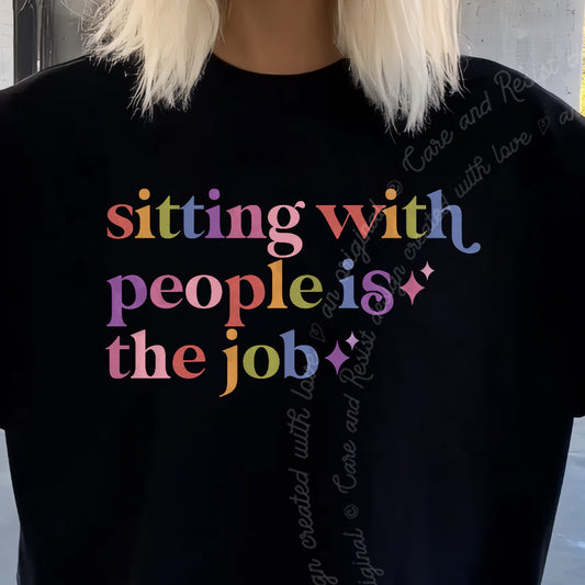 Sitting With People is the Job Care & Resist progressive t-shirt in Black
