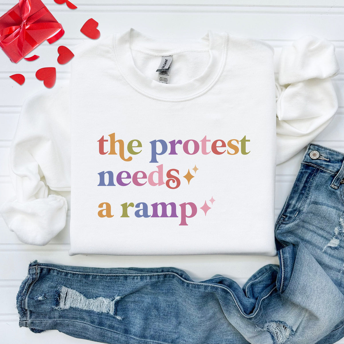 The Protest Needs a Ramp Care & Resist Gildan crewneck sweatshirt in White