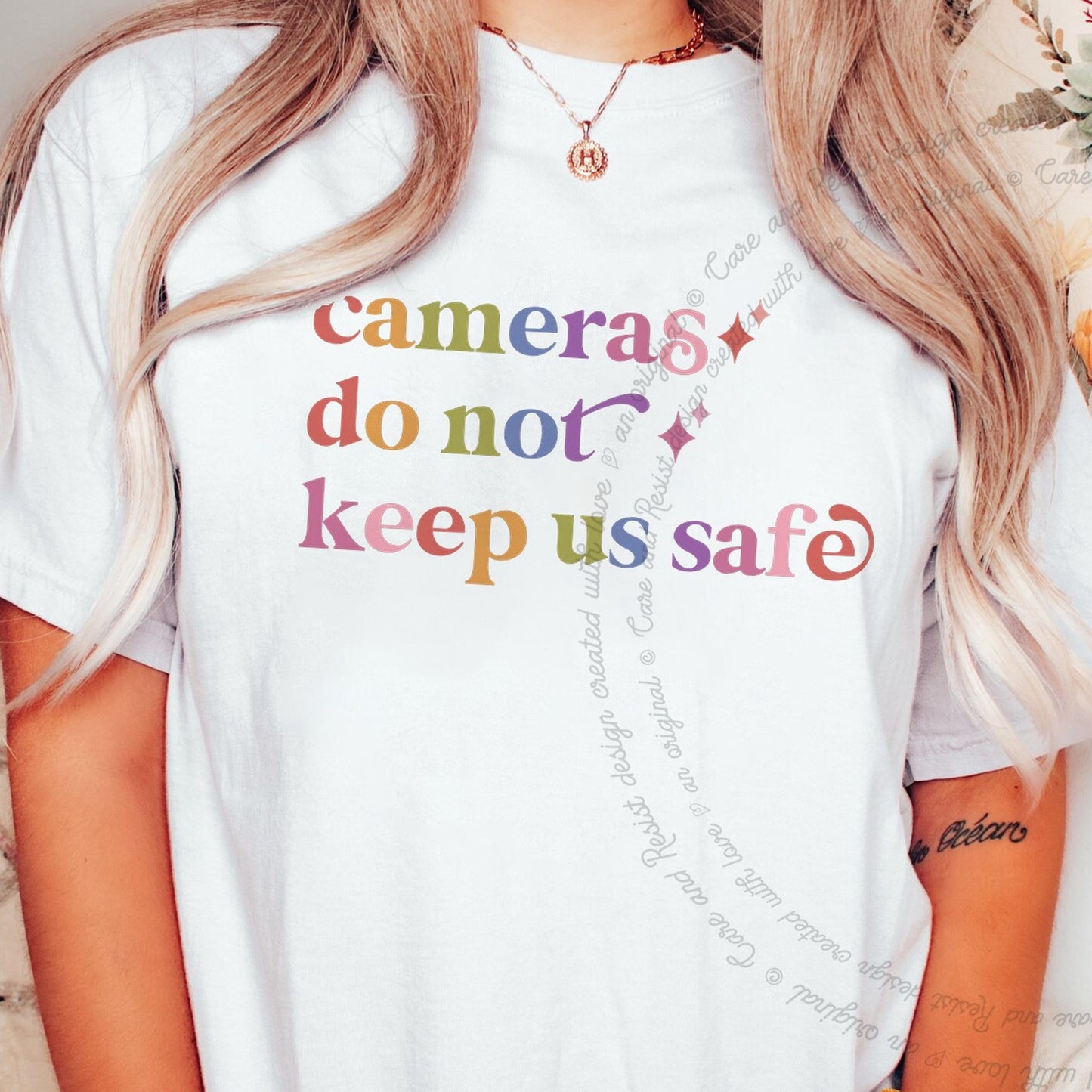 Cameras Do not Keep Us Safe Care & Resist rainbow Comfort Colors tee, White