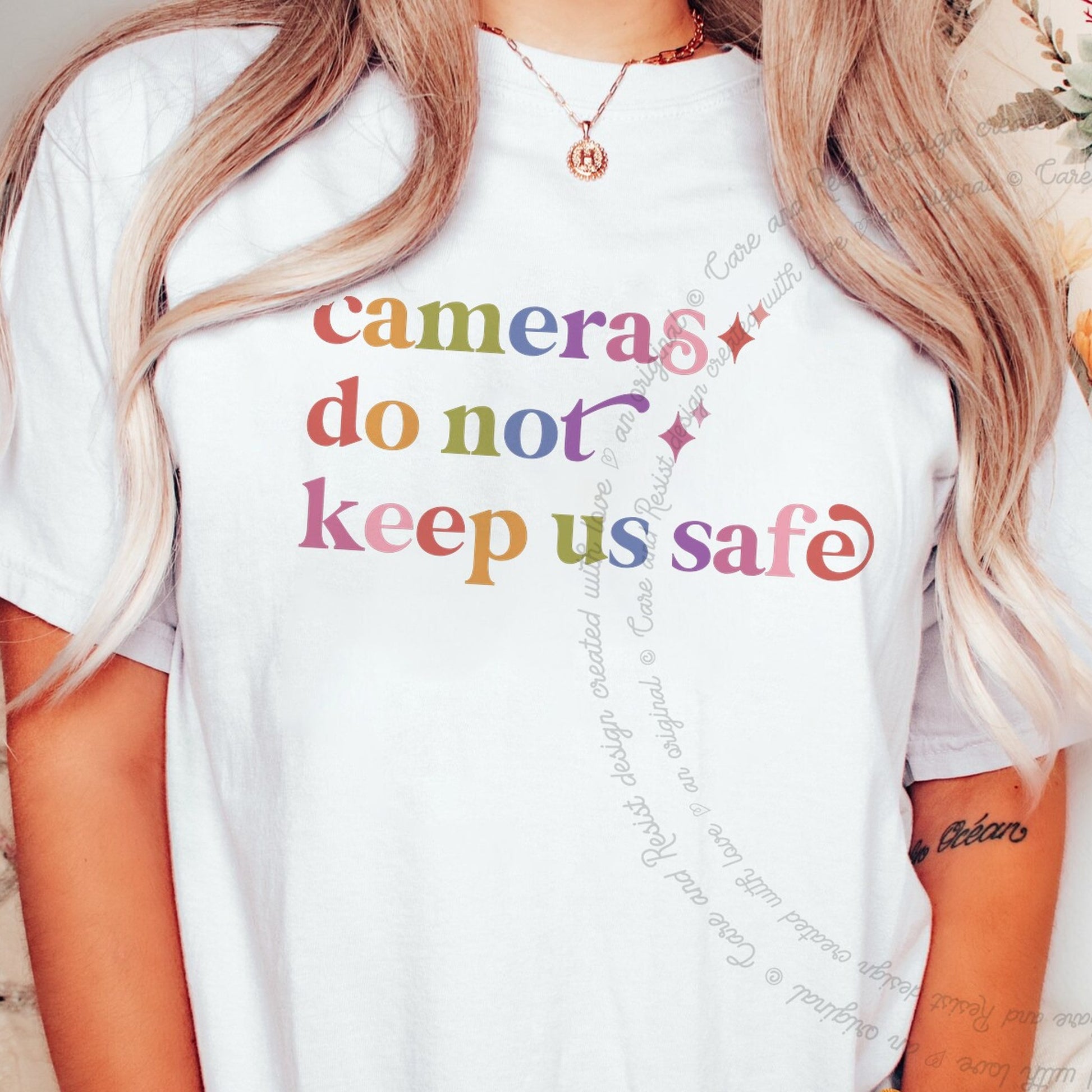 Cameras Do not Keep Us Safe Care & Resist rainbow Comfort Colors tee, White