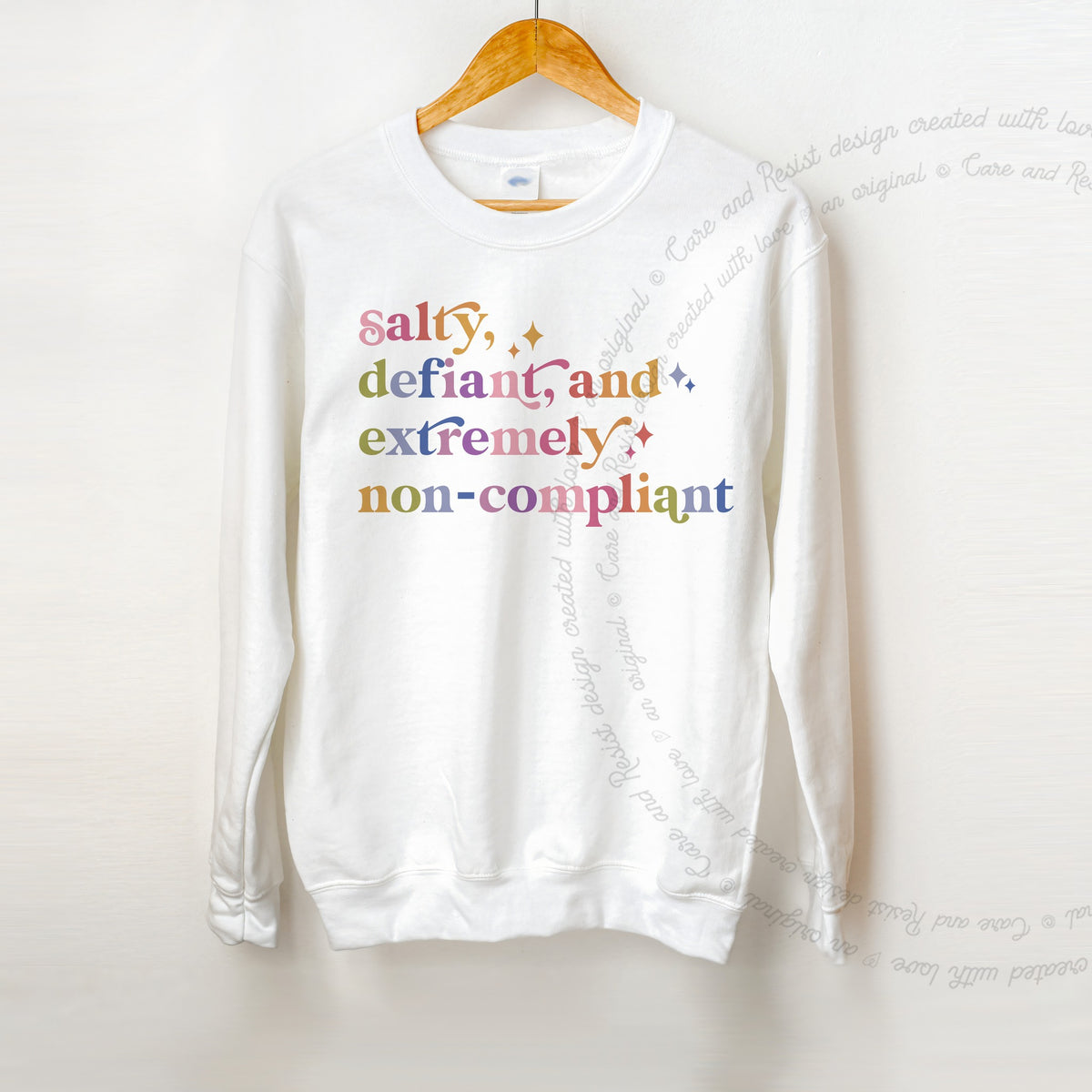 Salty, Defiant, and Extremely Non-compliant Care & Resist Gildan crewneck sweatshirt in White