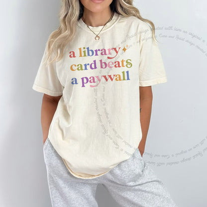 A Library Card Beats a Paywall Care & Resist rainbow tee