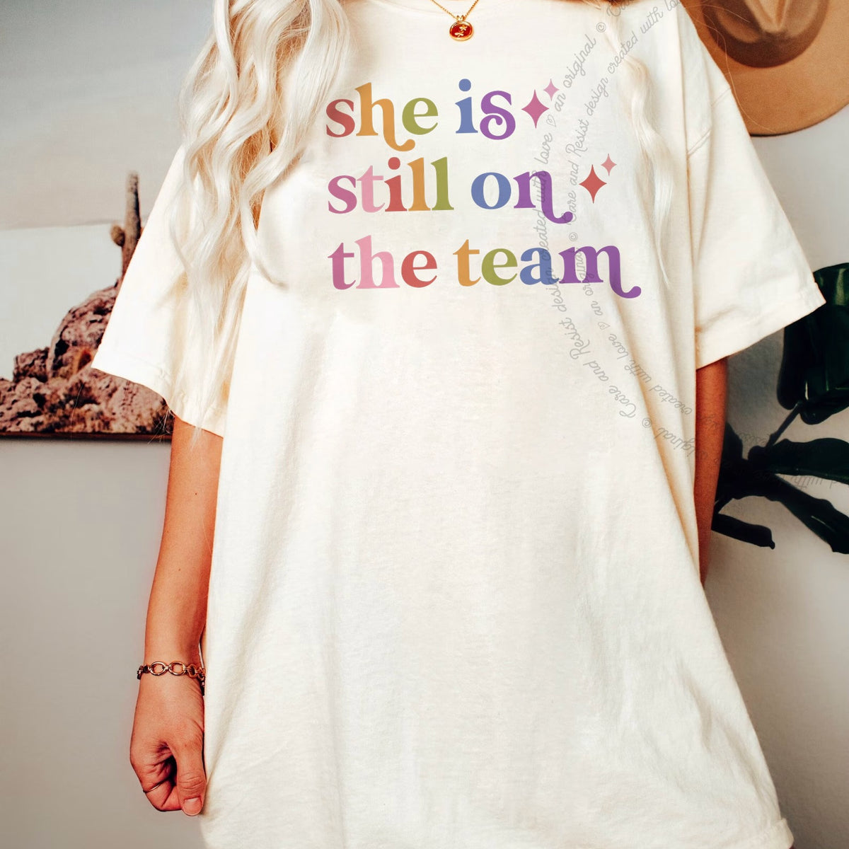 She is Still on the Team Care & Resist progressive t-shirt in Ivory