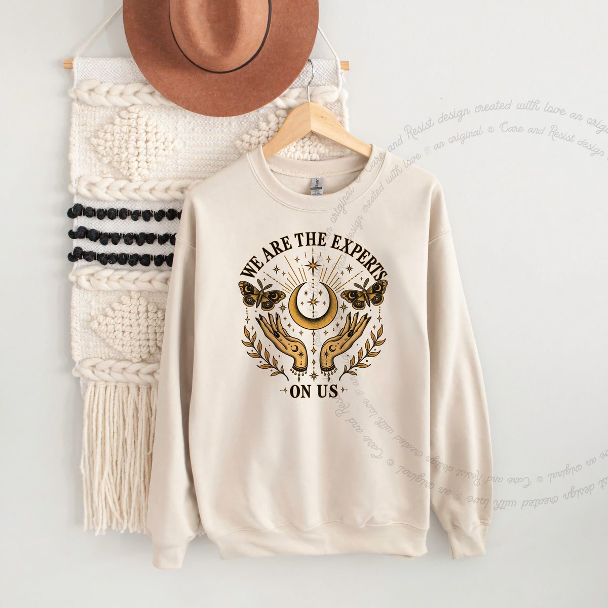 We are the Experts on Us Celestial Care & Resist Gildan crewneck sweatshirt in Sand