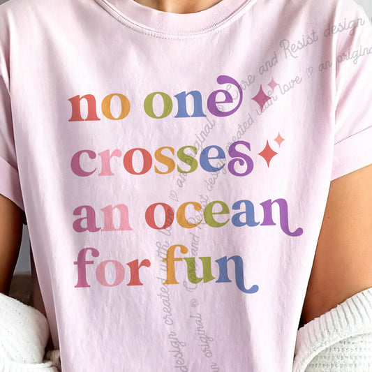 No One Crosses an Ocean for Fun Care & Resist progressive t-shirt in Blossom