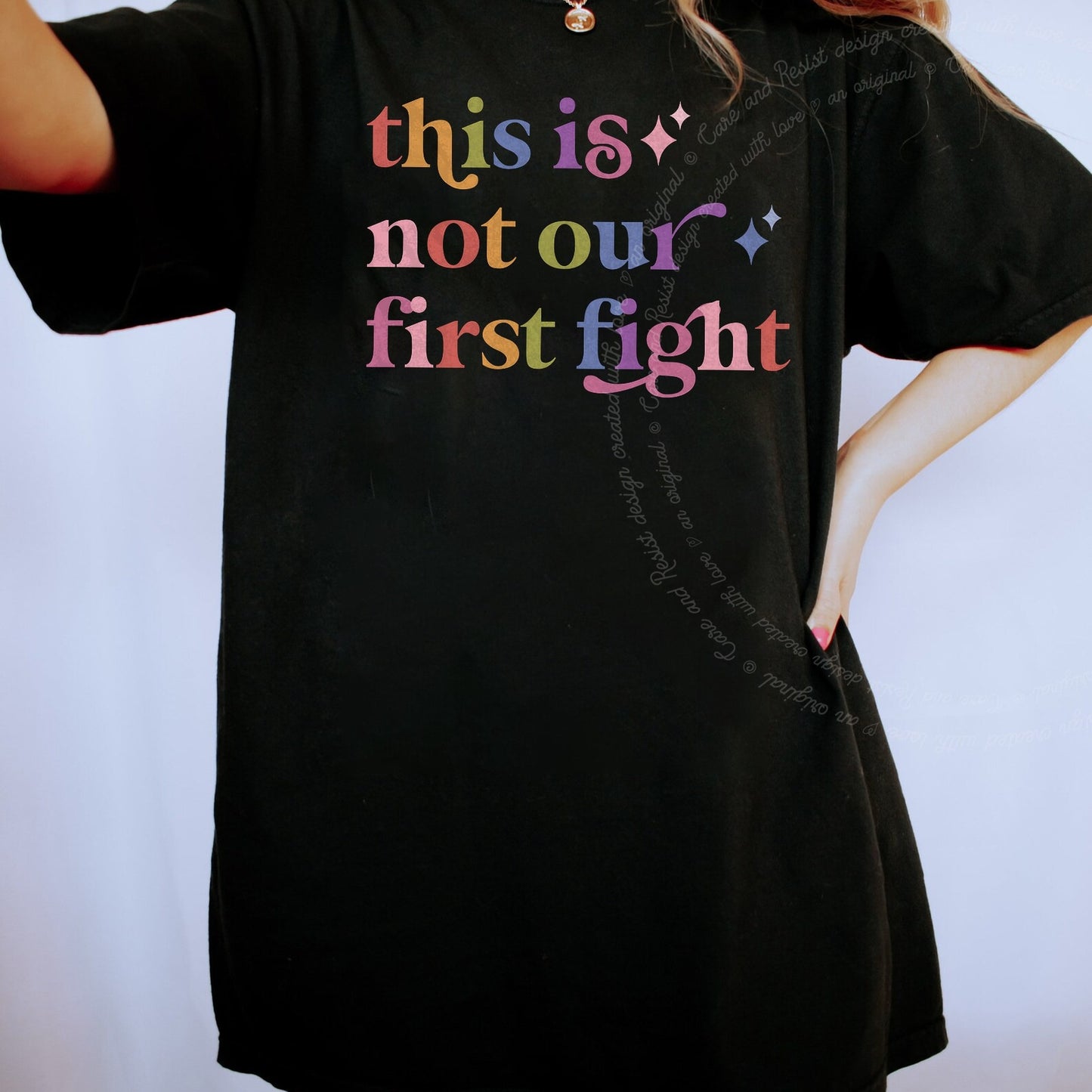 This is not Our First Fight Care & Resist rainbow tee